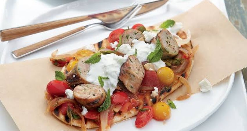 Cook together! Cook and share Sausages with Greek salad and pitta bread